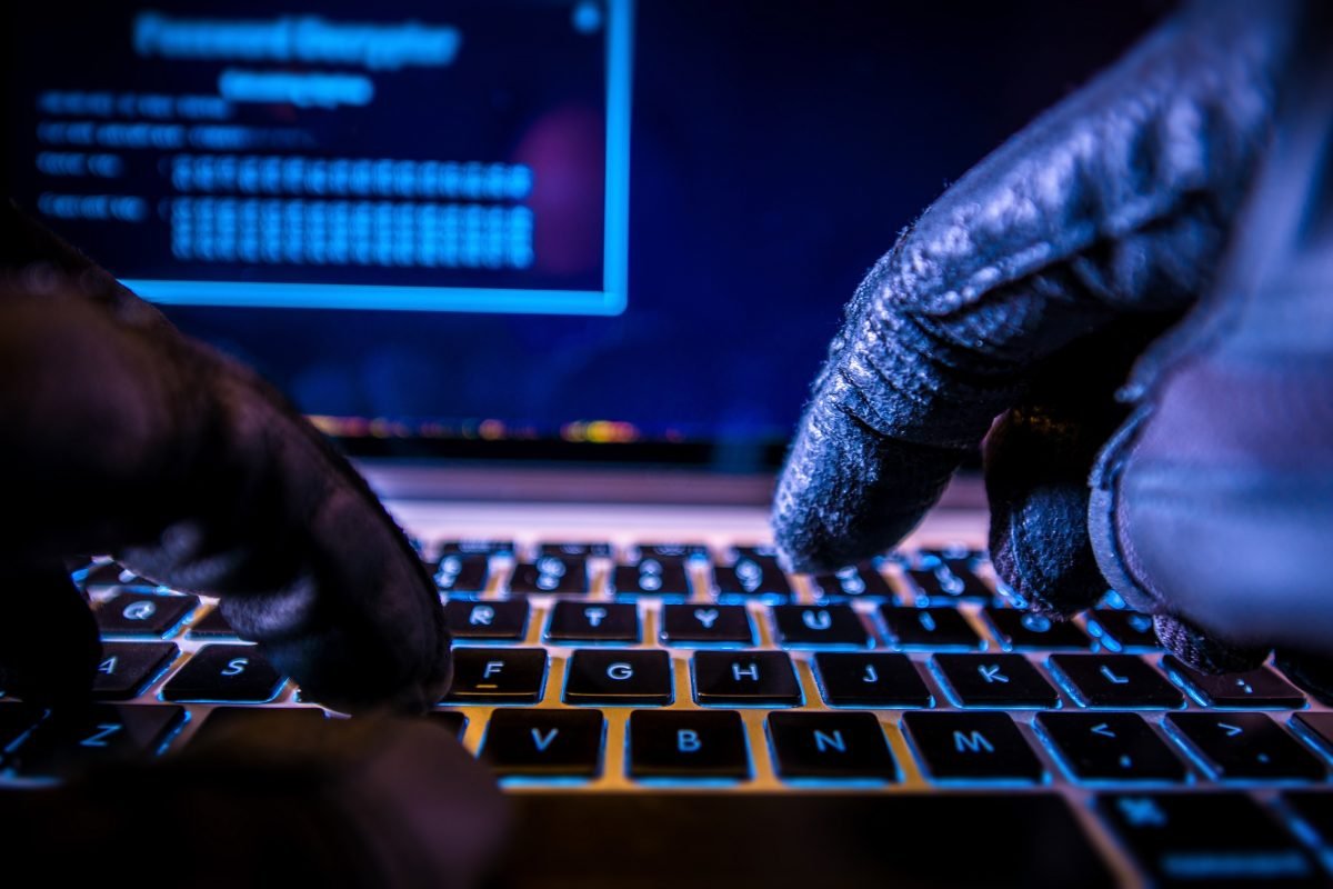 Hacker gloved hands
